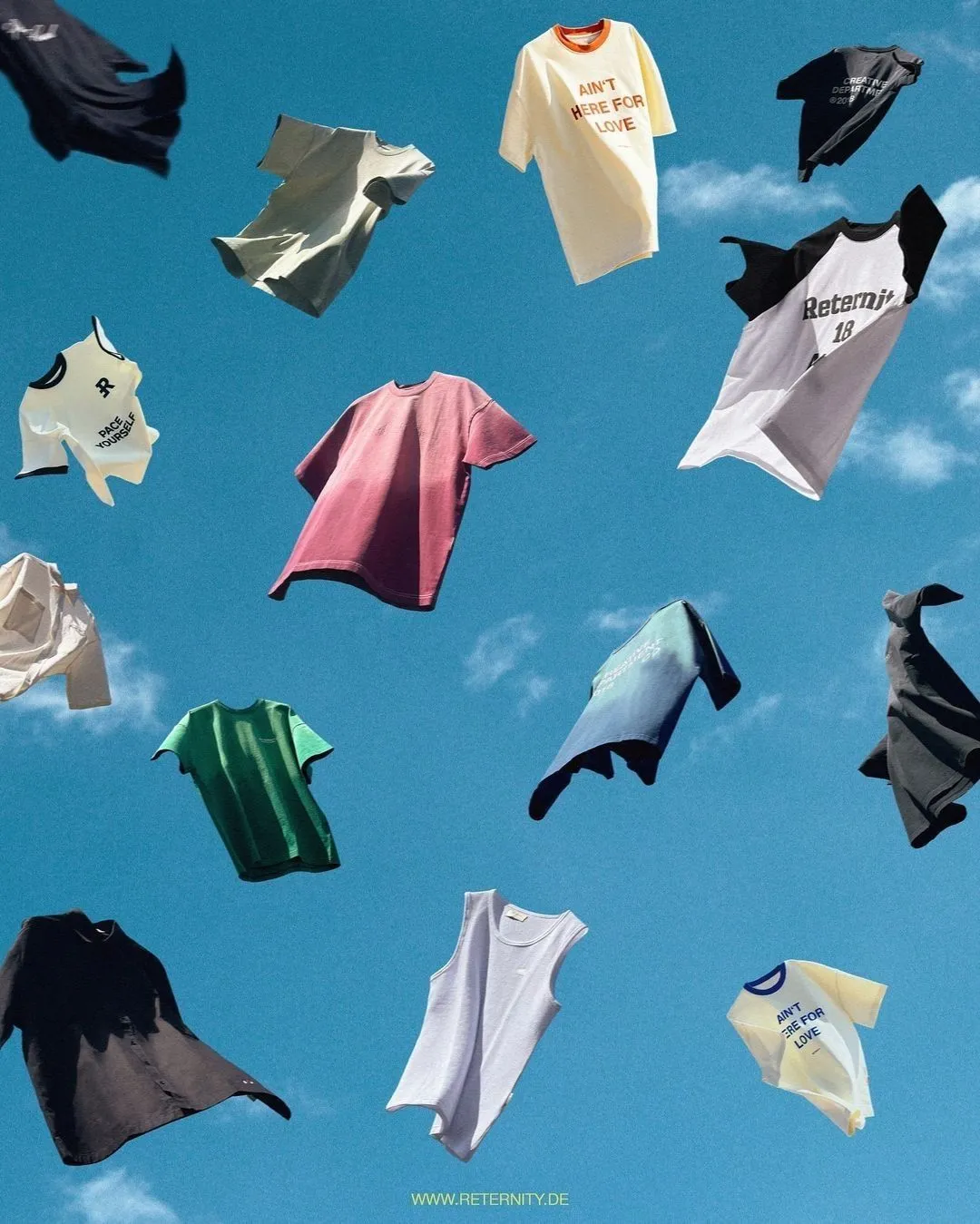 Shirts and other clothes flying against a blue sky.